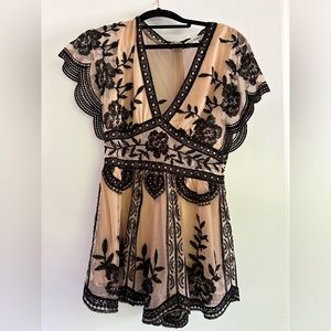 Wild honey romper,nude and black. Can be casual or dressy a tad revealing.